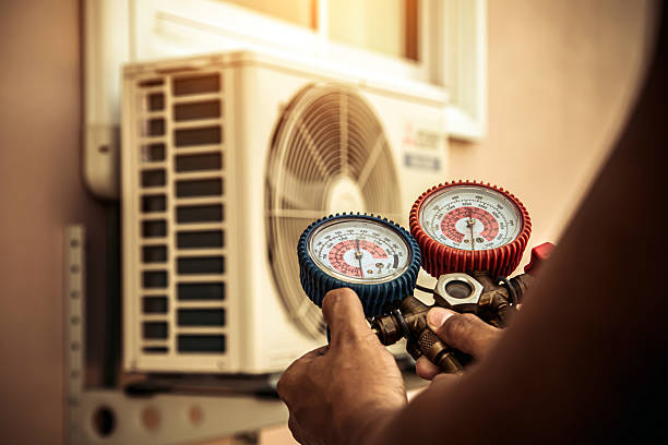 Professional Heat Pump Repair technician working in Aurora, NY